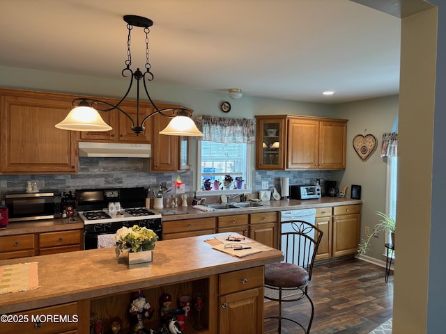 9 Pine Grove Ave, Manahawkin, NJ 08050 - kitchen with black gas range, stainless steel microwave, under cabinet range hood, a sink, and white dishwasher