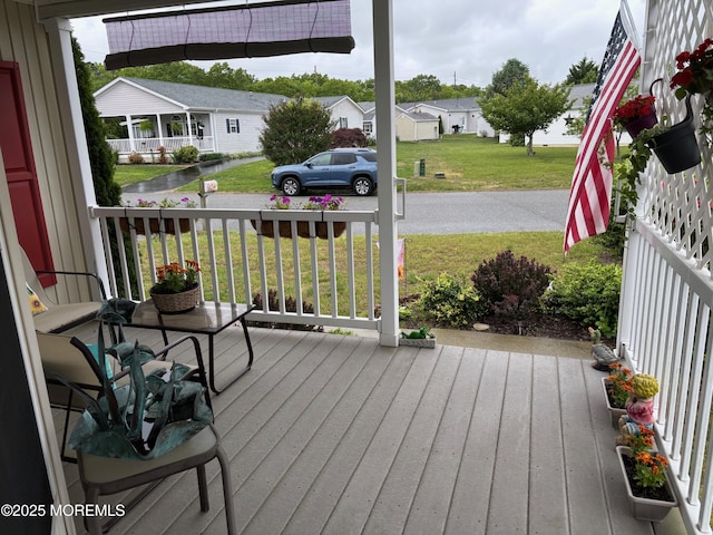 9 Pine Grove Ave, Manahawkin, NJ 08050 - wooden porch with a residential view and a yard