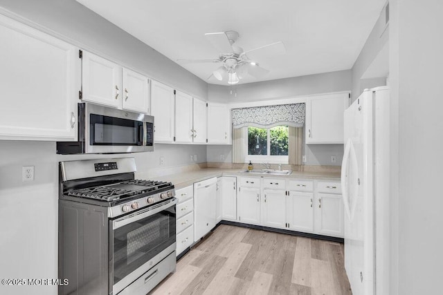 14 Emerald Dr Unit B, Barnegat, NJ 08005 - kitchen featuring appliances with stainless steel finishes, ceiling fan, a sink, and white cabinetry