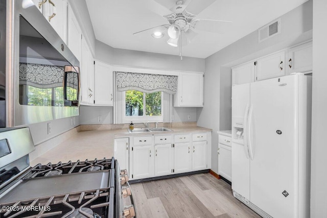 14 Emerald Dr Unit B, Barnegat, NJ 08005 - kitchen featuring stainless steel appliances, ceiling fan, a sink, white cabinets, and light countertops