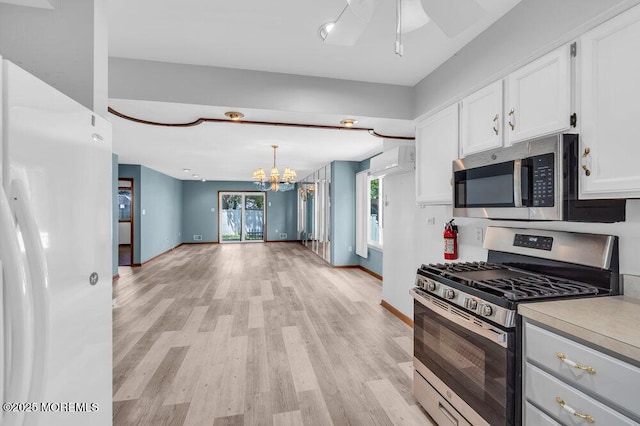 14 Emerald Dr Unit B, Barnegat, NJ 08005 - kitchen with appliances with stainless steel finishes, a chandelier, light wood finished floors, white cabinets, and baseboards