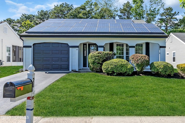 28 Twyford Ln, Manchester, NJ 08759 - view of front of home with a front lawn, driveway, roof mounted solar panels, and a garage