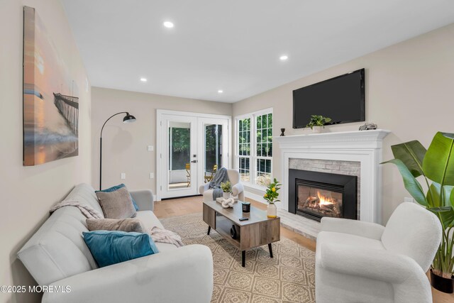 28 Twyford Ln, Manchester, NJ 08759 - living area featuring wood finished floors, recessed lighting, french doors, and a brick fireplace