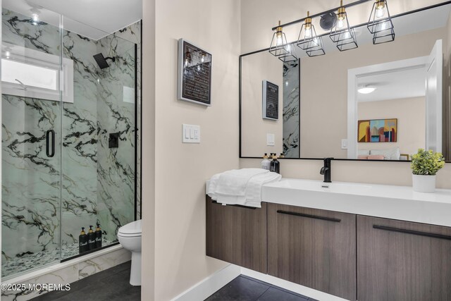 28 Twyford Ln, Manchester, NJ 08759 - bathroom featuring marble look tiles, a marble finish shower, toilet, baseboards, and vanity