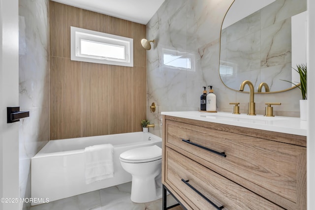 28 Twyford Ln, Manchester, NJ 08759 - bathroom with marble finish floors, toilet, tile walls, shower / bath combination, and vanity