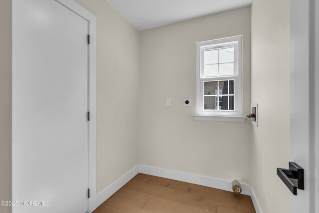 28 Twyford Ln, Manchester, NJ 08759 - laundry room featuring electric dryer hookup, washer hookup, wood finished floors, and baseboards