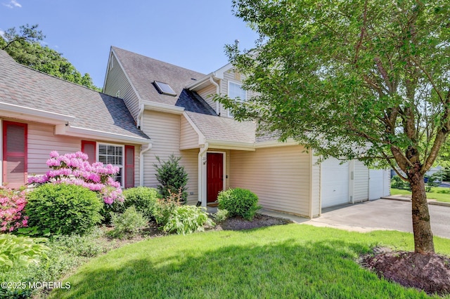 22 Commons Dr, Neptune Township, NJ 07753 - view of front of home featuring concrete driveway, a shingled roof, and a front yard