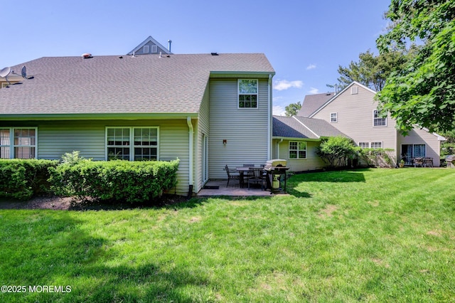 22 Commons Dr, Neptune Township, NJ 07753 - back of property featuring a lawn, a patio area, and a shingled roof