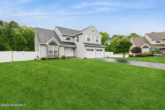 30 Thousand Oaks Ter, Howell, NJ 07731 - view of front of house featuring an attached garage, concrete driveway, a gate, and stone siding