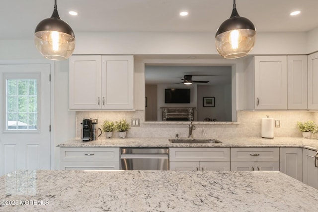 30 Thousand Oaks Ter, Howell, NJ 07731 - kitchen with stainless steel dishwasher, a sink, white cabinets, and recessed lighting
