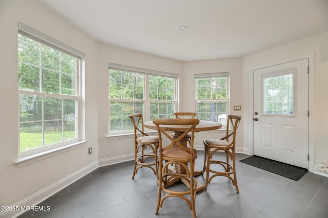 30 Thousand Oaks Ter, Howell, NJ 07731 - dining room featuring plenty of natural light, dark tile patterned flooring, and baseboards