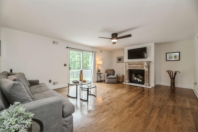 30 Thousand Oaks Ter, Howell, NJ 07731 - living area with ceiling fan, a premium fireplace, wood finished floors, and baseboards