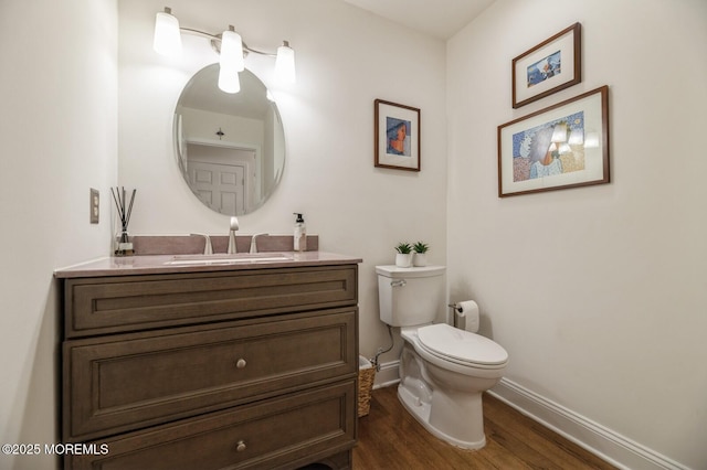 30 Thousand Oaks Ter, Howell, NJ 07731 - bathroom with baseboards, toilet, wood finished floors, and vanity