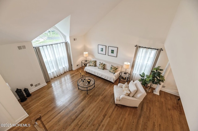 30 Thousand Oaks Ter, Howell, NJ 07731 - living room featuring vaulted ceiling, wood finished floors, and baseboards