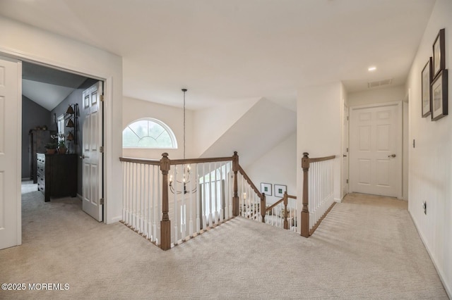 30 Thousand Oaks Ter, Howell, NJ 07731 - hall featuring carpet flooring, an upstairs landing, vaulted ceiling, and baseboards