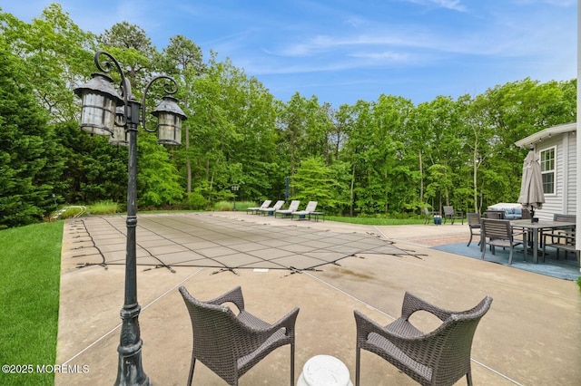 30 Thousand Oaks Ter, Howell, NJ 07731 - view of patio featuring a covered pool and view of wooded area
