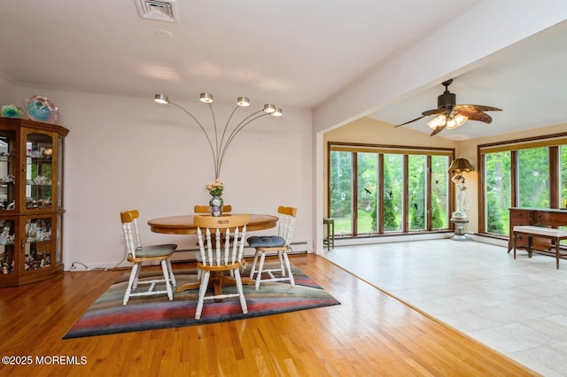 668 Clifton Ave, Toms River, NJ 08753 - dining space featuring ceiling fan, vaulted ceiling, and wood finished floors