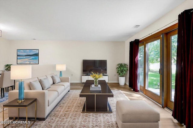 48 Scarborough Ct Unit 7, Freehold, NJ 07728 - living area featuring baseboards and wood finished floors