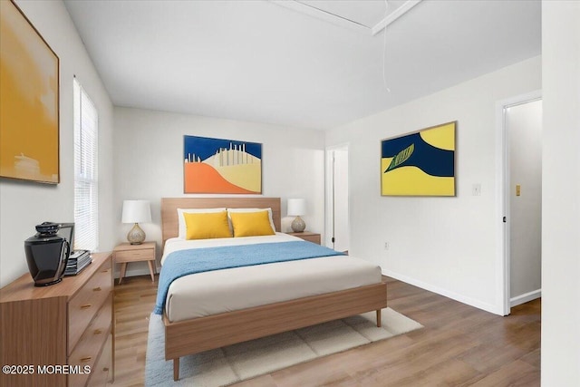 48 Scarborough Ct Unit 7, Freehold, NJ 07728 - bedroom featuring wood finished floors, baseboards, and attic access