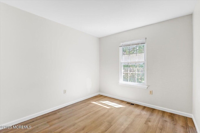48 Scarborough Ct Unit 7, Freehold, NJ 07728 - empty room with baseboards and wood finished floors