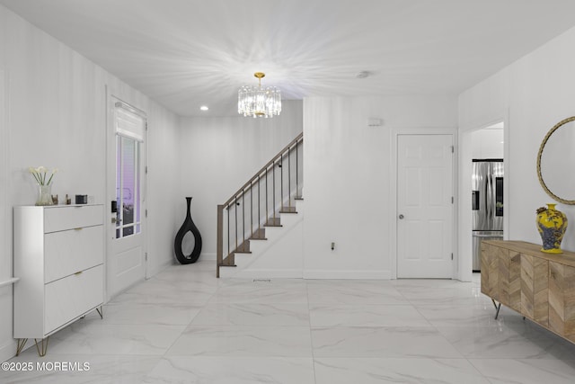 11 Clay St, West Long Branch, NJ 07764 - foyer with light marble finish flooring, a chandelier, and baseboards