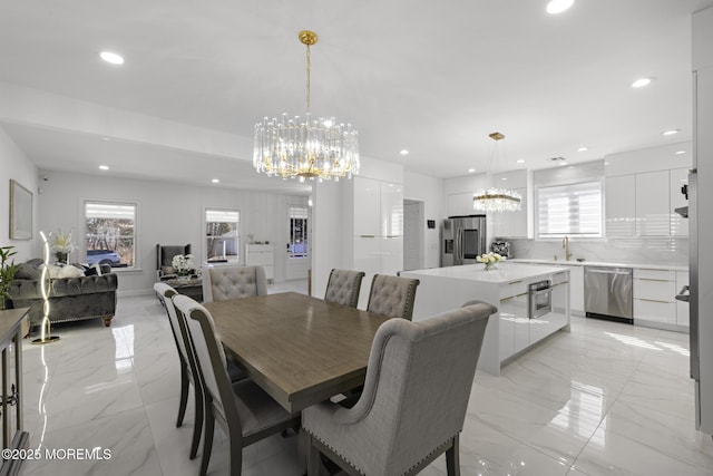 11 Clay St, West Long Branch, NJ 07764 - dining area with a chandelier, recessed lighting, light marble finish floors, and healthy amount of natural light