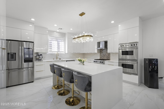 11 Clay St, West Long Branch, NJ 07764 - kitchen featuring stainless steel appliances, modern cabinets, wall chimney range hood, a sink, and recessed lighting