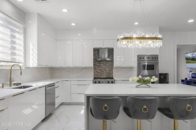 11 Clay St, West Long Branch, NJ 07764 - kitchen featuring modern cabinets, a sink, appliances with stainless steel finishes, white cabinets, and a breakfast bar