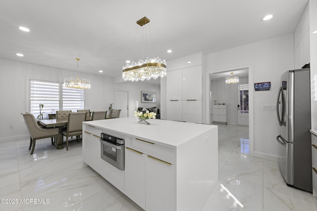 11 Clay St, West Long Branch, NJ 07764 - kitchen featuring stainless steel appliances, a chandelier, modern cabinets, light marble finish flooring, and white cabinetry