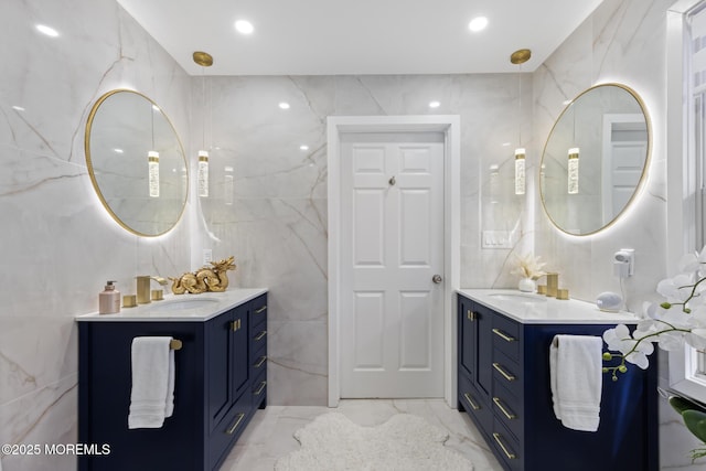11 Clay St, West Long Branch, NJ 07764 - bathroom featuring tile walls, marble tiled flooring, two vanities, and recessed lighting
