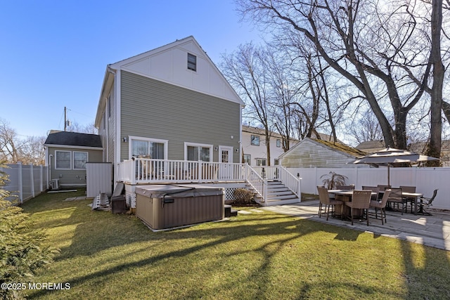 11 Clay St, West Long Branch, NJ 07764 - back of property featuring a hot tub, a patio area, board and batten siding, and a deck