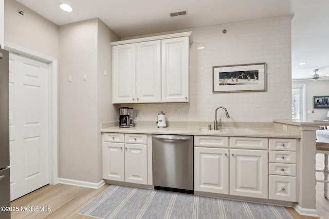 33 Cooper Ave Unit 401, Long Branch, NJ 07740 - kitchen featuring stainless steel dishwasher, a sink, light wood finished floors, white cabinetry, and a ceiling fan