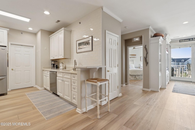 33 Cooper Ave Unit 401, Long Branch, NJ 07740 - kitchen with stainless steel appliances, light wood-style flooring, white cabinets, light countertops, and recessed lighting