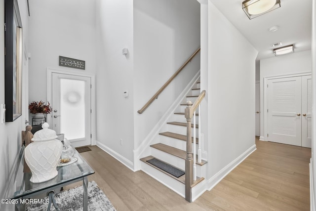 115 Hedgerow Ln, Manalapan, NJ 07726 - entryway featuring light wood-style flooring, stairs, and baseboards