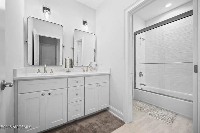 115 Hedgerow Ln, Manalapan, NJ 07726 - full bath with double vanity,  shower combination, wood finished floors, and baseboards
