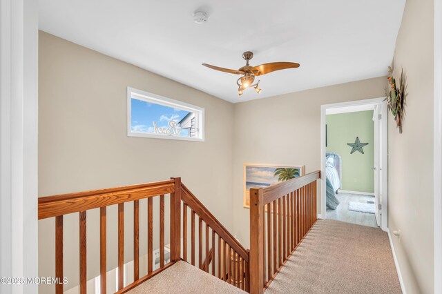 1007 Aloha Dr, Forked River, NJ 08731 - hallway with an upstairs landing and carpet