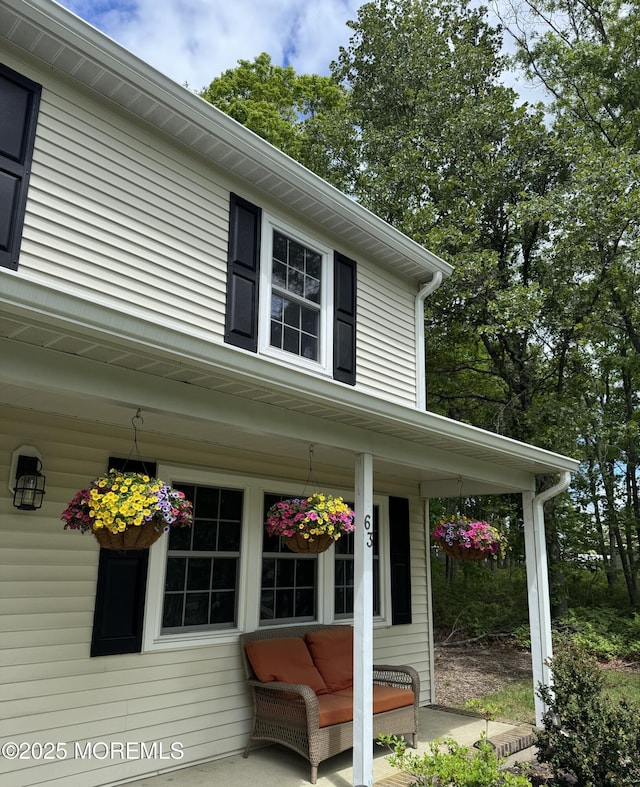 63 1st St, Barnegat, NJ 08005 - view of side of home featuring a porch