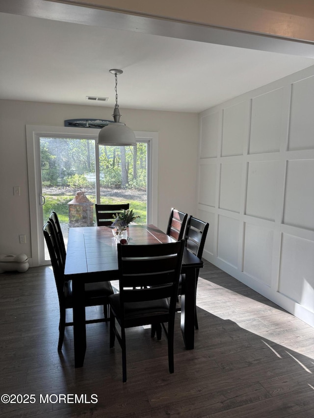 63 1st St, Barnegat, NJ 08005 - dining room featuring dark wood-type flooring and a decorative wall