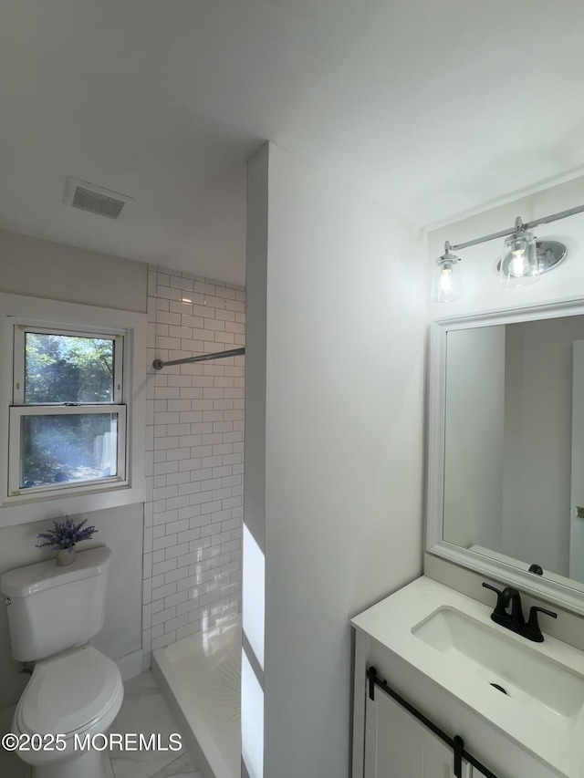 63 1st St, Barnegat, NJ 08005 - full bathroom with toilet, tiled shower, and vanity