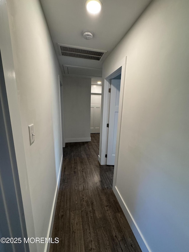 63 1st St, Barnegat, NJ 08005 - hall with dark wood-style flooring, baseboards, and attic access