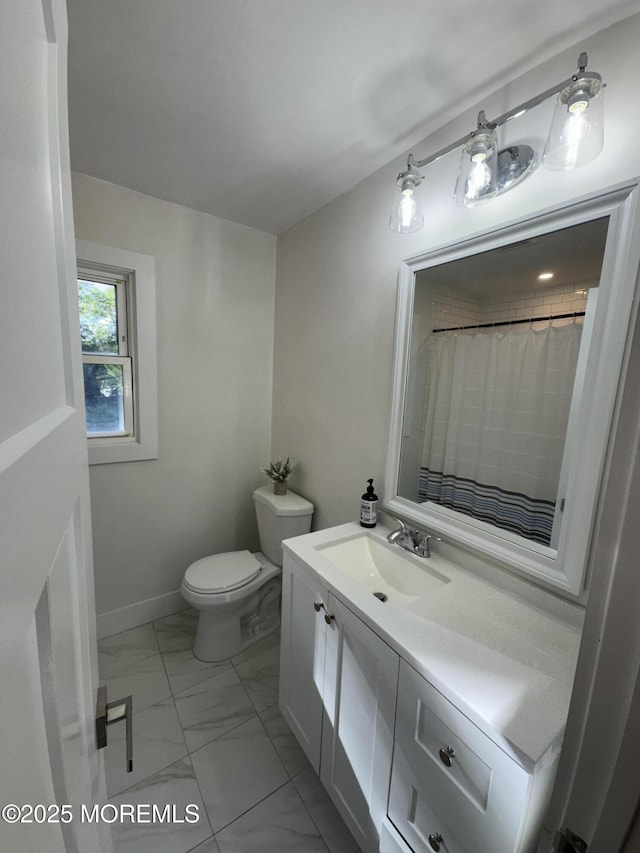 63 1st St, Barnegat, NJ 08005 - bathroom featuring marble look tile flooring, vanity, toilet, and baseboards