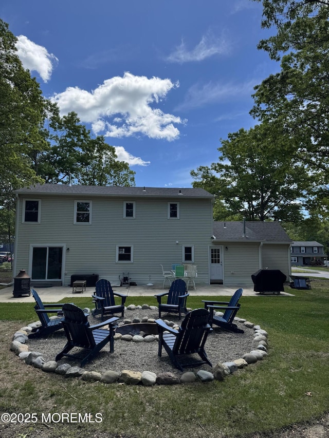 63 1st St, Barnegat, NJ 08005 - back of property with an outdoor fire pit, a patio, and a yard
