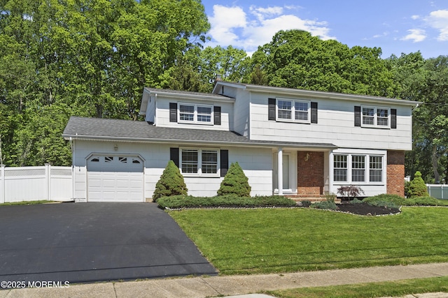 10 Pepperidge Rd, Howell, NJ 07731 - view of front of property with an attached garage, driveway, and brick siding