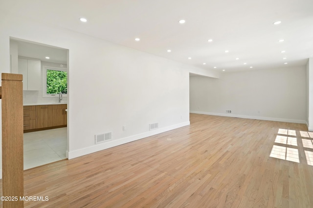 10 Pepperidge Rd, Howell, NJ 07731 - unfurnished room with light wood-type flooring, recessed lighting, baseboards, and a sink