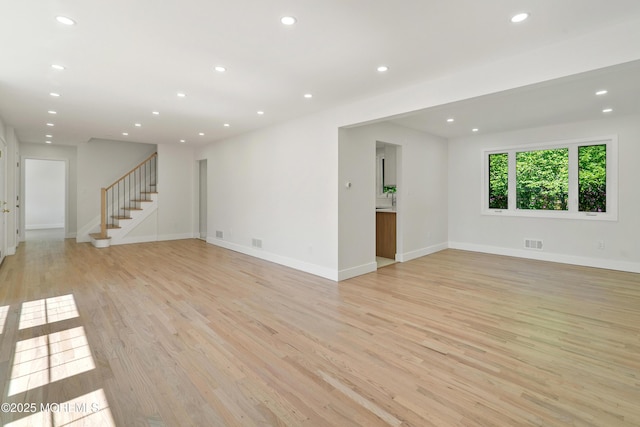 10 Pepperidge Rd, Howell, NJ 07731 - spare room featuring light wood-style flooring, stairway, recessed lighting, and baseboards