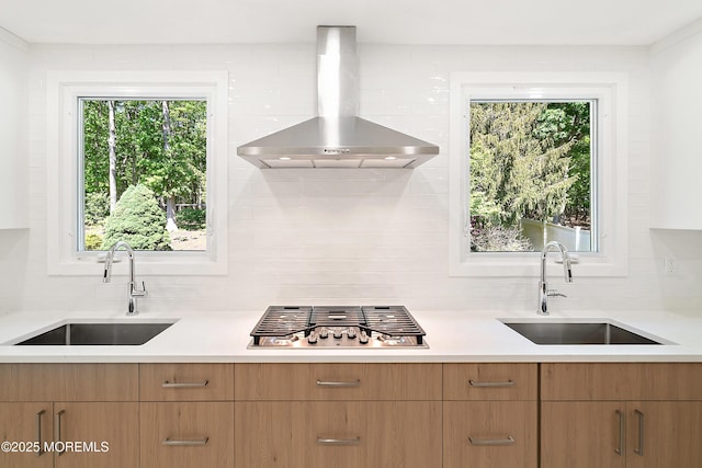 10 Pepperidge Rd, Howell, NJ 07731 - kitchen with wall chimney exhaust hood, a sink, stainless steel gas cooktop, and light countertops