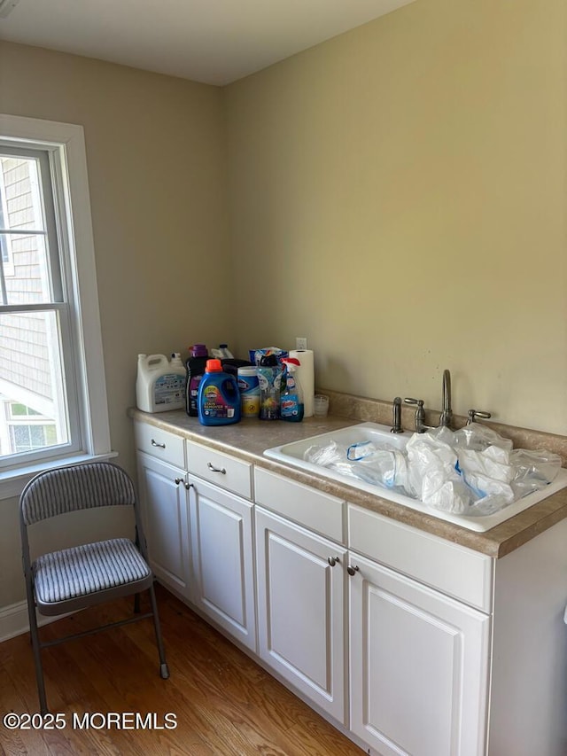 231 Friendship Rd, Howell, NJ 07731 - bar area with a sink and light wood-style flooring