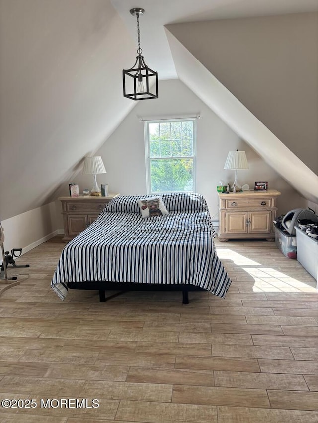 231 Friendship Rd, Howell, NJ 07731 - bedroom with vaulted ceiling and wood finished floors