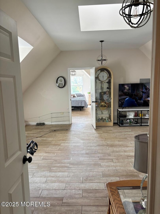 231 Friendship Rd, Howell, NJ 07731 - corridor featuring a skylight, vaulted ceiling, and wood finished floors