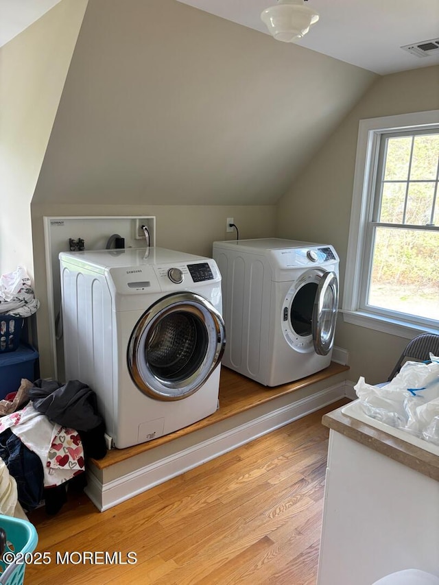 231 Friendship Rd, Howell, NJ 07731 - laundry area with washer and dryer and light wood finished floors